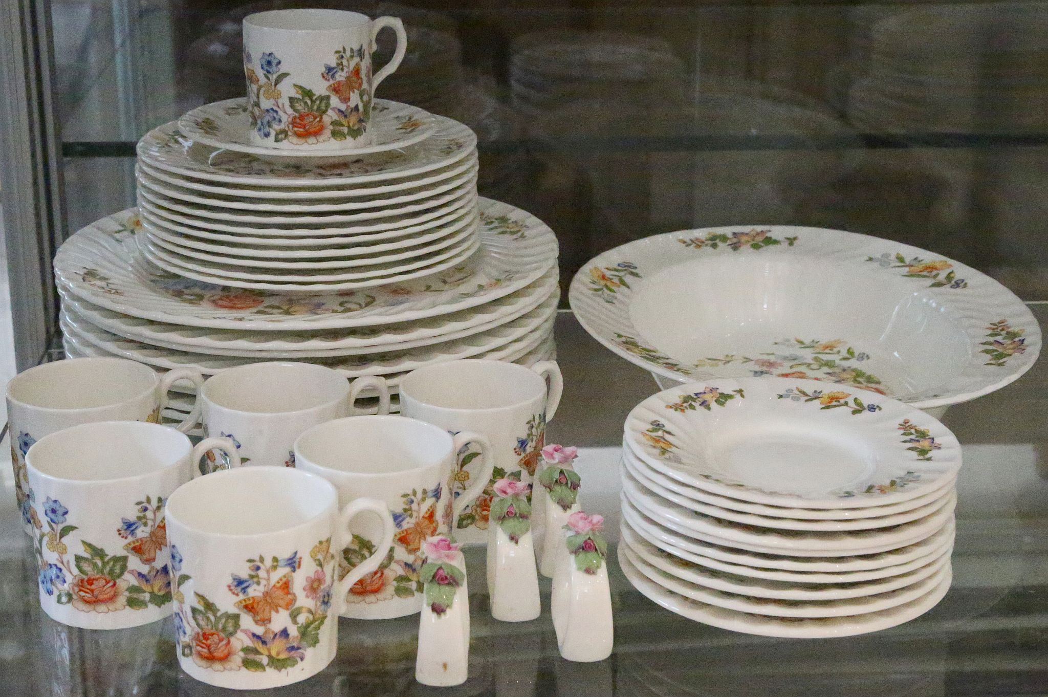 A good collection of Anynsley 'Cottage Garden' tea and dinner ware, and some 'Wild Violets' items (