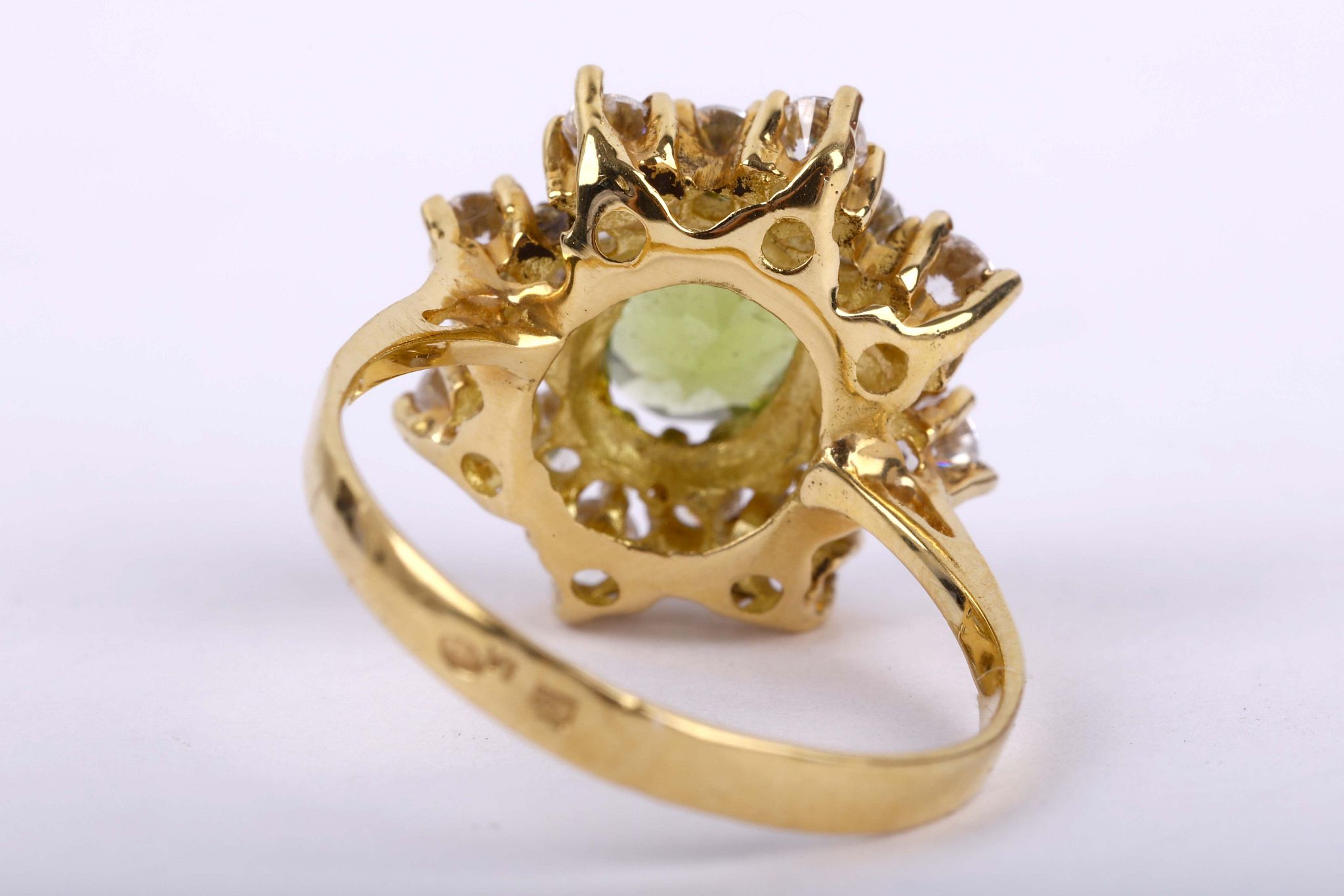 A peridot cluster ring              The oval-cut peridot, within a cluster of brilliant-cut cubic - Image 2 of 3