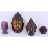 An antique South East Asian gilt bronze Buddha mask 14cm, a bronze Buddha head 11cm, another small