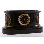 A late 19th Century black slate mantle clock with applied bronze reliefs, black face with gilt Roman