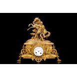 A LATE 19TH CENTURY FRENCH GILT METAL MANTEL CLOCK DEPICTING A MARLY HORSE the dial set into the