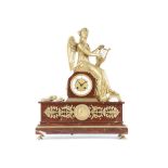 A 19TH CENTURY FRENCH GILT BRONZE AND ROUGE GRIOTTE MARBLE FIGURAL MANTEL CLOCK the dial set