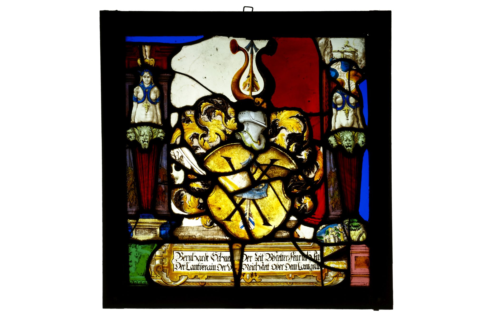 A 16TH CENTURY SWISS STAINED GLASS PANEL DEPICTING A HERALDIC CREST the central shield with an arrow