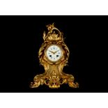 A MID 19TH CENTURY FRENCH ROCOCO REVIVAL GILT BRONZE MANTEL CLOCK BY BOZZO, ANGERS the case ornately