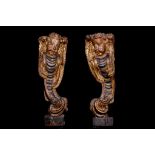 A LARGE PAIR OF 17TH SOUTH GERMAN CARVED LIMEWOOD, POLYCHROME AND PARCEL GILT DECORATED PUTTO