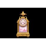 A FRENCH NAPOLEON III PERIOD GILT BRONZE AND PORCELAIN MANTEL CLOCK the break-arch case surmounted