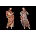 A LARGE PAIR OF 16TH CENTURY SOUTH GERMAN CARVED WOOD AND POLYCHROME DECORATED RELIEFS OF SAINTS the