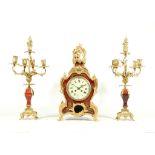 A MID 19TH CENTURY FRENCH 'BOULLE STYLE' TORTOISESHELL, GILT AND CUT BRASS CLOCK GARNITURE the clock