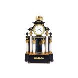 A 19TH CENTURY AUSTRIAN EBONISED, ALABASTER AND GILT METAL MOUNTED PORTICO CLOCK the drum case