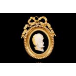 A LATE 19TH CENTURY MOTHER OF PEARL AND GILT BRONZE MOUNTED CAMEO PORTRAIT RELIEF OF A TURK shown in