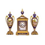 A LATE 19TH CENTURY FRENCH GILT BRONZE AND PORCELAIN CLOCK GARNITURE the clock case with canted