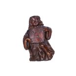 A 17TH / 18TH CENTURY ITALIAN CARVED WALNUT ANGEL SUPPORTING A SHIELD carved with a flat back, the