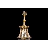 A 17TH CENTURY OTTOMAN (TURKISH) BRASS TULIP CANDLESTICK of typical form, the rippled and knopped