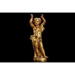 AN EARLY 19TH CENTURY FRENCH GILT BRONZE FIGURE OF A PUTTO the cherub with arms raised to support