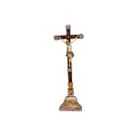 AN 18TH CENTURY SPANISH COLONIAL CARVED WOOD, POLYCHROME AND SILVERED CRUCIFIX Christ on the cross