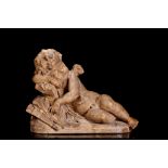 A 19TH CENTURY TERRACOTTA FIGURE OF THE SLEEPING CUPID SIGNED 'A. HASSE' the reclining putto