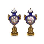 A LARGE AND IMPRESSIVE PAIR OF LATE 19TH CENTURY FRENCH SEVRES STYLE PORCELAIN AND GILT BRONZE