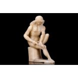 A 17TH CENTURY MALINES ALABASTER FIGURE OF THE SPINARIO, AFTER THE ANTIQUE the nude male figure