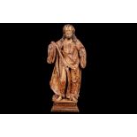 A 15TH CENTURY FLEMISH CARVED AND POLYCHROME DECORATED FIGURE OF A SAINT the standing figure in full