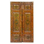 A PAIR OF 19TH CENTURY PERSIAN QAJAR LACQUERED AND GILT DECORATED DOORS each door with a central