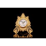 A 19TH CENTURY GILT BRASS STRUT CLOCK IN THE MANNER OF THOMAS COLE the case engraved with C