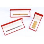 CARTIER A gold plated Cartier cigarette lighter (boxed), sold together with a gold plated Cartier