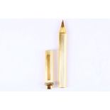 CARTIER PEN A gold plated Cartier ball point pen, with reeded body, the removable cap have a gold