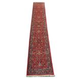 A Persian Sarouk runner, Central Iran, 4.57m x 0.78m, condition rating A