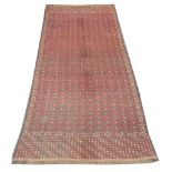 An early 20th Century Turkoman Soumakh carpet, 4.10m x 2.03m, condition rating B.