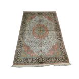 A Kashmir silk carpet, 2.74m x 1.82m, condition rating B.