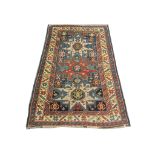 An early 20th Century Caucasian Kazak rug, 1.64m x 1.08m, condition rating B.