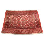 An early 20th Century Turkoman Juval rug, 1.32m x 0.90m, condition rating B.