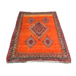 An early to mid 20th Century Persian Qashqai carpet, 2.68m x 2.15m, condition rating B.