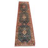 A Persian Saveh runner, 2.96m x 0.75m, condition rating A