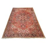 An early 20th Century Persian Heriz carpet, North West Iran, 3.53m x 2.54m, condition rating B.