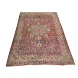 An early 20th Century Persian Kirman Laver carpet, 3.58m x 2.66m, condition rating B