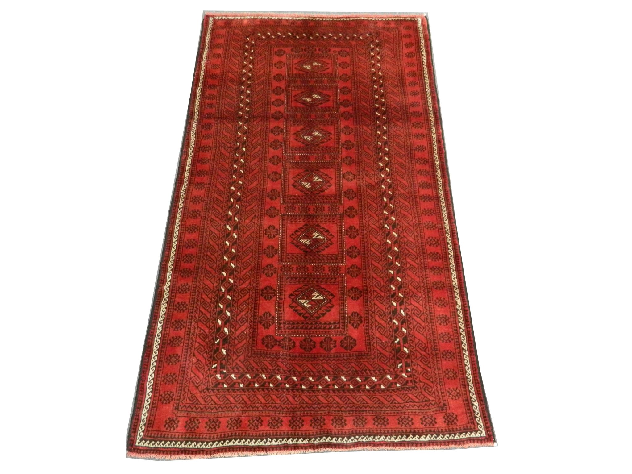 A Persian Turkoman rug, North East Iran, 2.12m x 1.15m, condition rating A/B