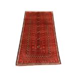 A Persian Turkoman rug, North East Iran, 2.12m x 1.15m, condition rating A/B