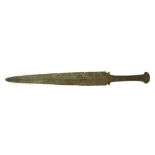 A LURISTAN BRONZE DAGGER Circa 10th-7th Century B.C. With short tapering blade, and the hollow hilt