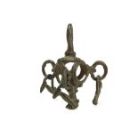 AN IRANIAN BRONZE PENDANT Iron Age, circa 700-100 B.C. A spherical openwork pendant with three small