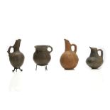 FOUR ANATOLIAN POTTERY VESSELS Circa 3rd-1st Millennium B.C. Including three greyware vessels, one