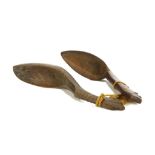 TWO TRIBAL WOODEN SPOONS Tied together with string, 20cm-24cm long, (2) Provenance: The property