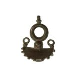 A ROMAN BRONZE HORSE OR CHARIOT BRIDLE ELEMENT Circa 1st-4th Century A.D. Composed of a circular