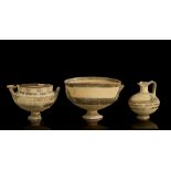 THREE CYPRIOT VESSELS Iron Age, circa 950-750 B.C. All white painted ware, including a jug with a