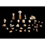 A GROUP OF ANCIENT TERRACOTTA FRAGMENTS Including a Pre-Columbian terracotta head, with high