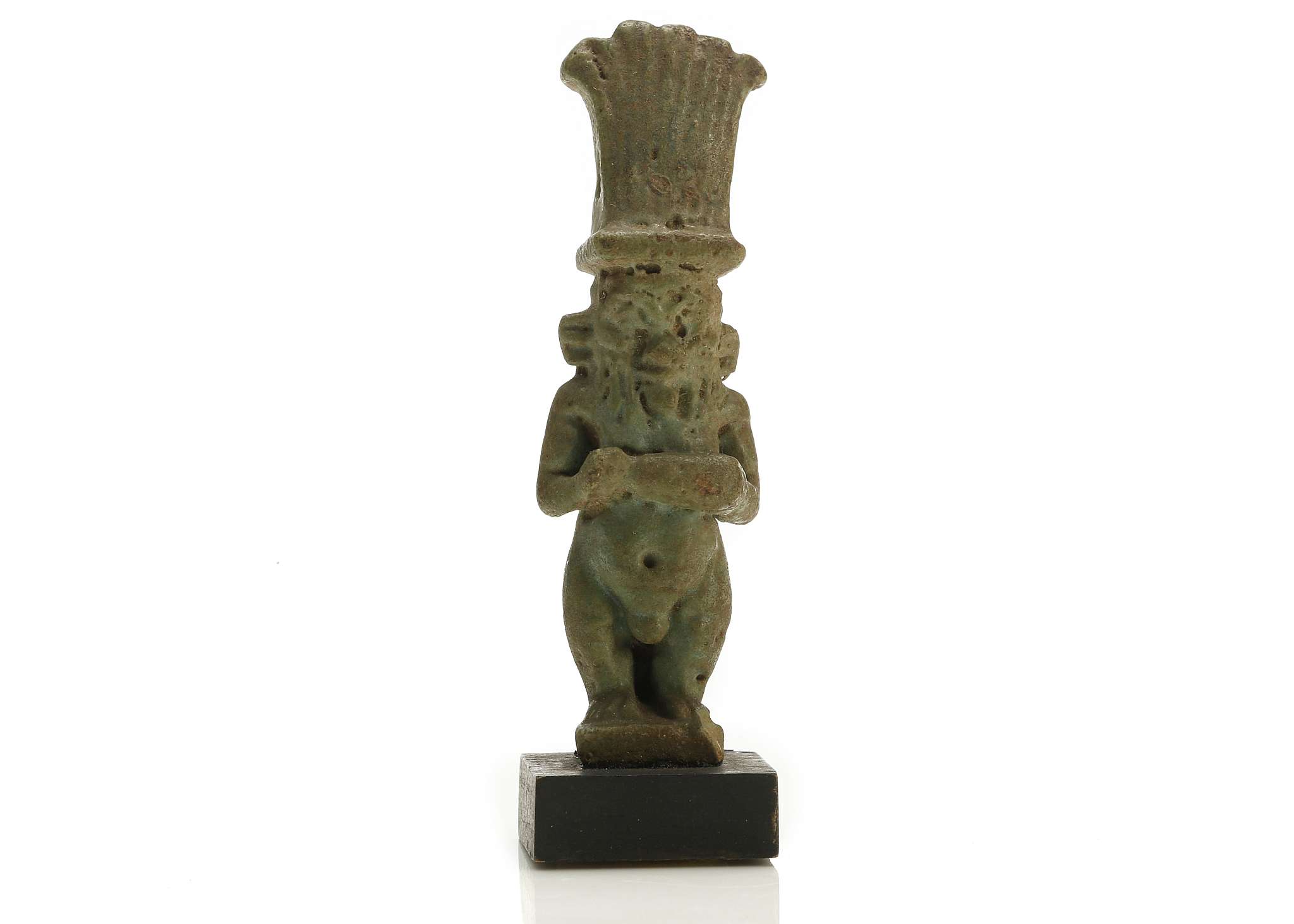 AN EGYPTIAN GLAZED COMPOSITION AMULET OF BES Late Period, circa 664-332 B.C. The dwarf god is