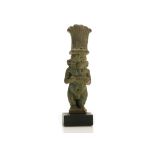 AN EGYPTIAN GLAZED COMPOSITION AMULET OF BES Late Period, circa 664-332 B.C. The dwarf god is