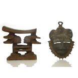 TWO AFRICAN ITEMS Including a bronze Baule mask, Ivory Coast, 18cm high, and a Luba wooden headrest,