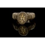 A MEDIEVAL SILVER RING Circa 12th Century A.D. The hoop with incised decoration, three ridges on