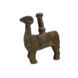 A WOODEN STRAINER AND PESTLE Schematically carved in the form of a ram, with incised geometric